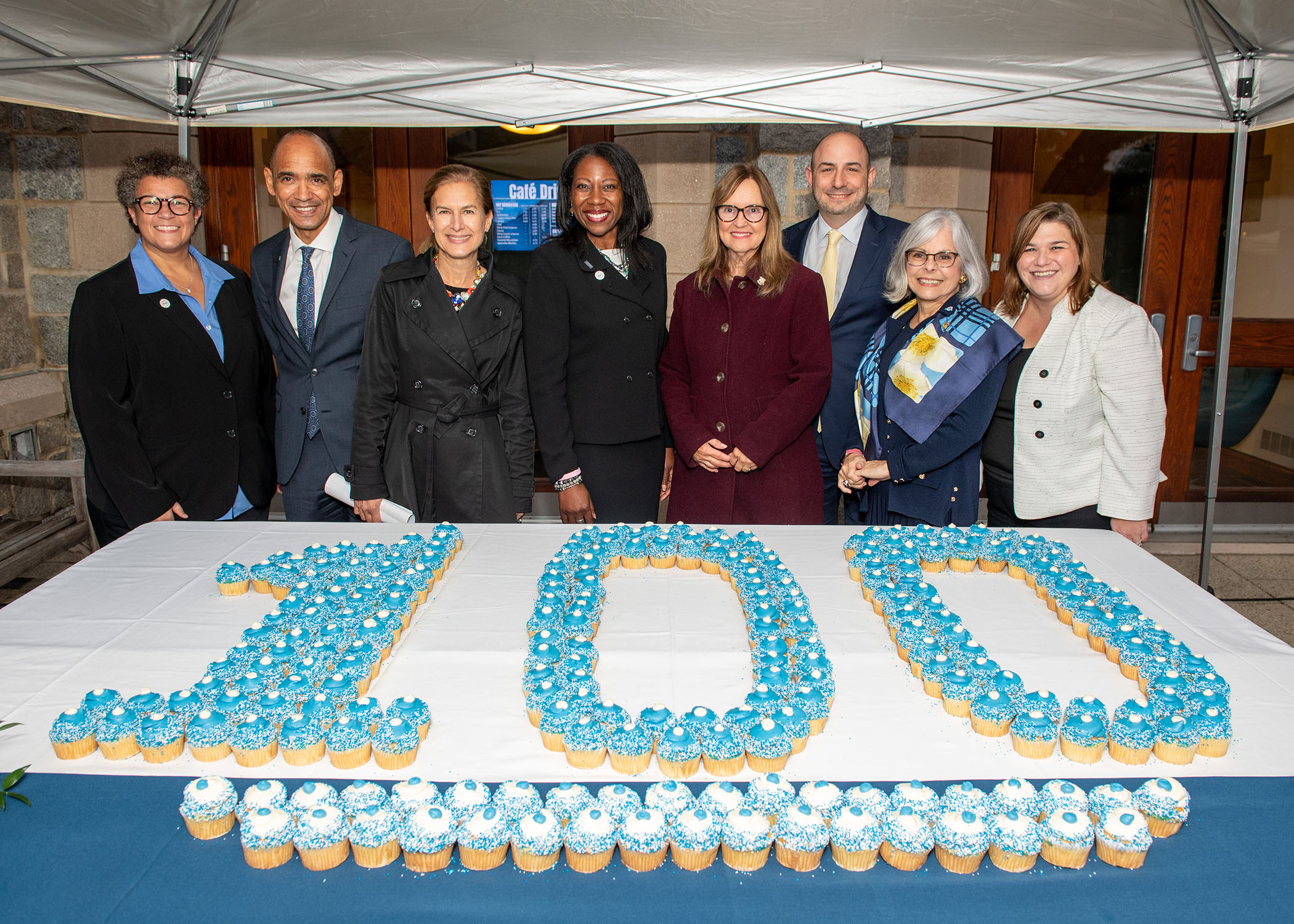 Founders' Day speakers with cupcakes spelling 100